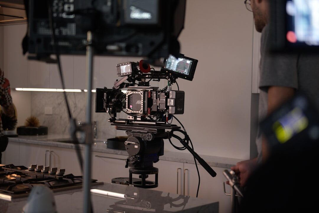 Television studio with multiple cameras pointed at a presenter desk