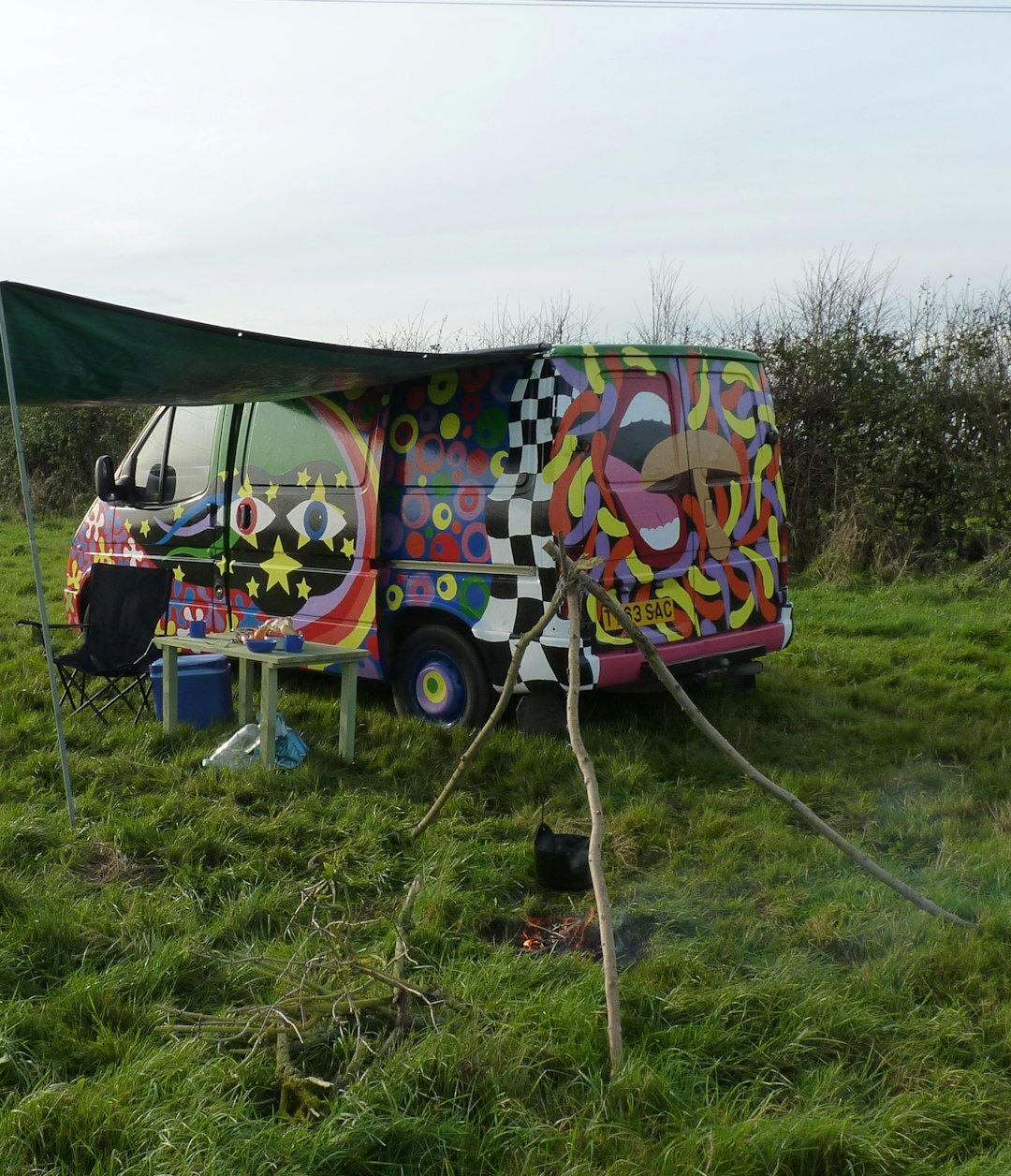 Outside broadcast van with satellite dish and cables at an event